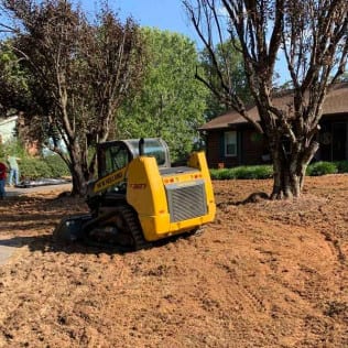 Track loader grading